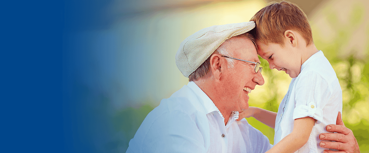 elderly man enjoying time with grandson
